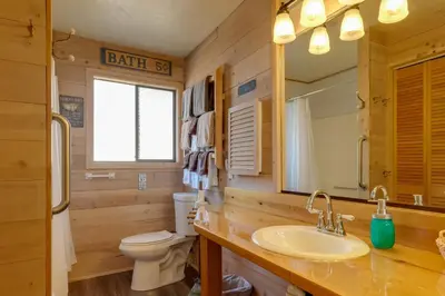 a bathroom with a sink and a toilet and a mirror at Secluded Mountain Hideaway Less Than 8 Miles to Bass Lake! in North Fork