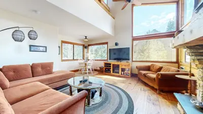 a living room with a couch and a table at Rainbow Villas #1 condo in Mammoth Lakes