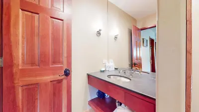 a bathroom with a sink and a mirror at Rainbow Villas #1 condo in Mammoth Lakes