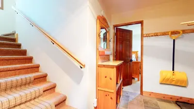 a staircase in a home with a stair case at Rainbow Villas #1 condo in Mammoth Lakes