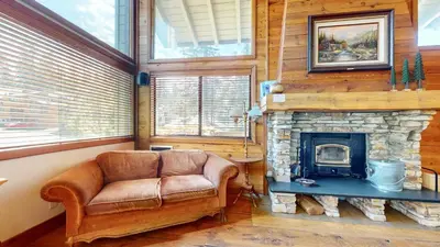 a living room with a couch and a fireplace at Rainbow Villas #1 condo in Mammoth Lakes