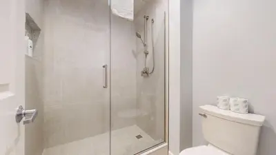 a bathroom with a shower and a toilet at Mammoth Green #102 condo in Mammoth Lakes