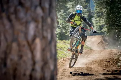 a person riding a bike on a dirt trail at Modern 1 bedroom in Ski Trails condo in Kingswood Estates