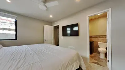 a bedroom with a white bed and a toilet at 1849 Condos 511 condo in Mammoth Lakes