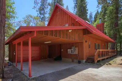 a large red barn with a garage at 92R Jolie Cabin in North Wawona