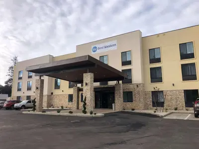 a hospital building with a car parked in a parking lot at Best Western Colfax in Colfax