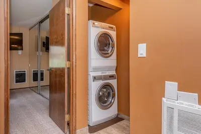 a laundry room with a washer and dryer at Helios 11N in Mammoth Lakes