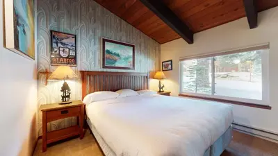 a bedroom with a large bed and a window at Mammoth Estates 3 Bdrm Condos - Walking Distance to The Village Gondola Station in Mammoth Lakes