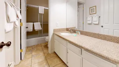 a bathroom with a sink and a toilet and a mirror at Mammoth Estates 3 Bdrm Condos - Walking Distance to The Village Gondola Station in Mammoth Lakes