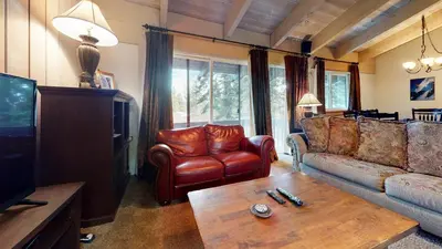 a living room with a couch and a coffee table at Mammoth Estates 3 Bdrm Condos - Walking Distance to The Village Gondola Station in Mammoth Lakes