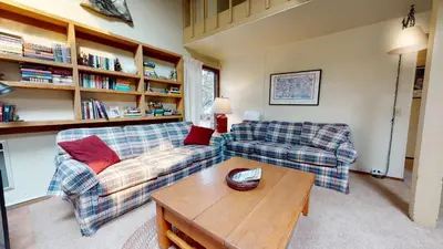 a living room with two couches and a coffee table at Mammoth Estates 2 Bedroom Condos Near Mammoth Village in Mammoth Lakes