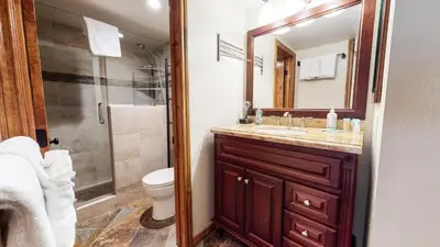 a bathroom with a sink and a toilet and a shower at Mammoth Estates Deluxe 2 Bedroom Condos in Mammoth Lakes