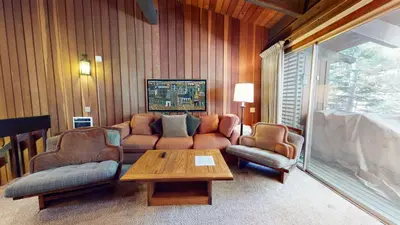 a living room with a couch and two chairs and a table at Mammoth Estates Deluxe 2 Bedroom Condos in Mammoth Lakes