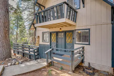 a small house with a balcony and a door at Balcony and Forest Views Cabin in Pioneer! in Pioneer