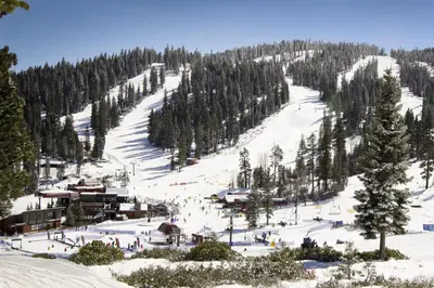 a ski slope with people skiing down a mountain at Northstar Gold Bend Retreat in Truckee