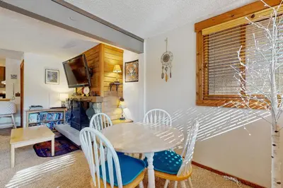 a dining room with a table and chairs at Unit 18A at Granlibakken in Tahoe City