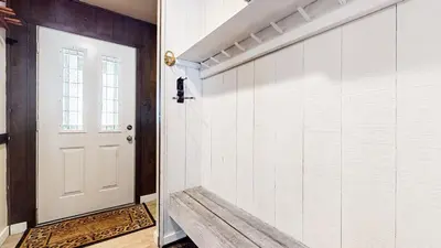 a hallway with a white door and a tile wall at Horizons 4 #189 condo in Mammoth Lakes