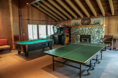 a room with a pool table and a fireplace at Horizons 4 #189 condo in Mammoth Lakes