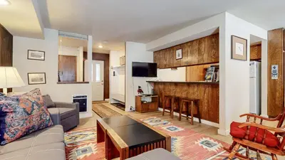 a living room with a couch and a table at Horizons 4 #189 condo in Mammoth Lakes