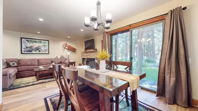 a dining room with a table and a couch at Snowcreek #13 condo in Mammoth Lakes