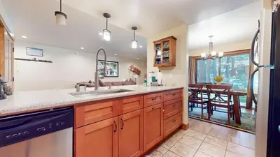 a kitchen with a sink and a dishwasher at Snowcreek #13 condo in Mammoth Lakes