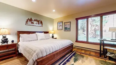 a bedroom with a bed and a window at Snowcreek #13 condo in Mammoth Lakes