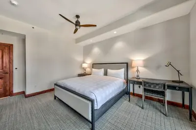 a bedroom with a bed and a ceiling fan at Luxury Three Bedroom Residence steps from Heavenly Village condo in South Lake Tahoe