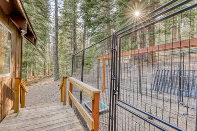 a wooden deck with a cage on the side of a house at Echo Escape in South Lake Tahoe