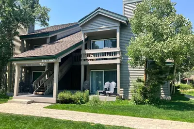a house with a deck and a balcony at Snowcreek 607 in Mammoth Lakes