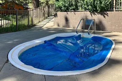 a large blue tub sitting on the side of a street at Summit 70 in Mammoth Lakes