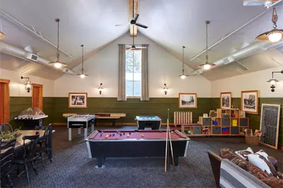 a billiard room with a pool table in the middle at Evergreen Lodge at Yosemite in Groveland