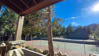 a tennis court with a tennis court at Summit #293 condo in Mammoth Lakes