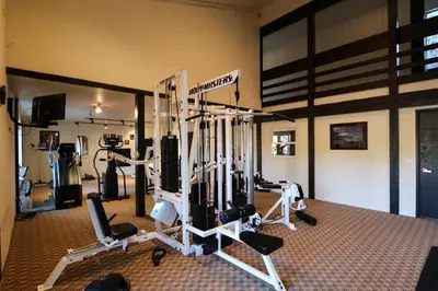 a gym with several tread machines in a room at Summit #293 condo in Mammoth Lakes