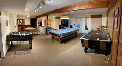 a large room with a pool table and a piano at Villa Alta Vista at Yosemite- Stunning Views and Game Room in Mariposa
