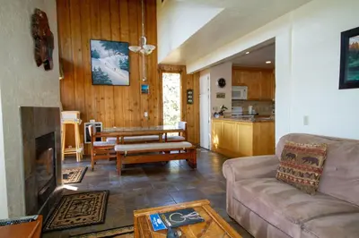 a living room with a couch and a table at Mammoth Ski Racquet Club 55 in Mammoth Lakes