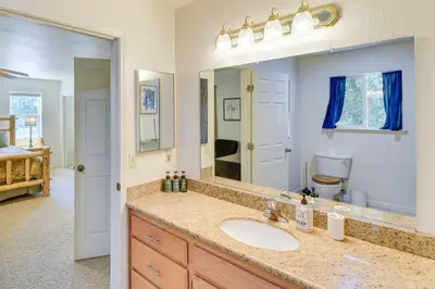 a bathroom with a sink and a mirror at Gateway to Yosemite Group-Friendly Groveland Home in Groveland