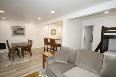a living room with a couch and a table at Mammoth Ski Racquet Club 127 in Mammoth Lakes