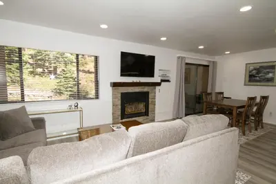 a living room with a couch and a fireplace at Mammoth Ski Racquet Club 127 in Mammoth Lakes
