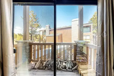 a view of a balcony from a window of a house at Summit 80 in Mammoth Lakes