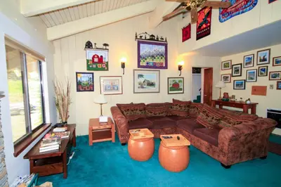 a living room with a couch and a table at Discovery 4 150 Loft in Mammoth Lakes