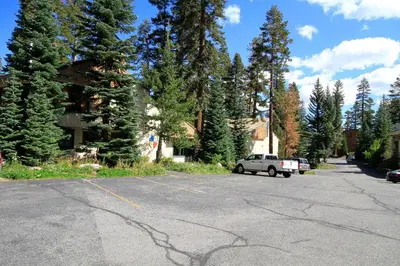 a car parked in a parking lot with trees at Discovery 4 150 Loft in Mammoth Lakes
