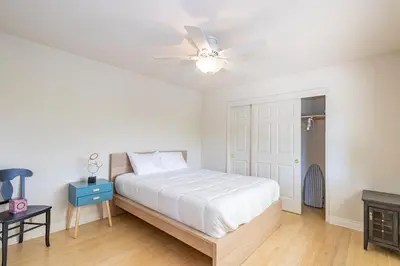 a white bedroom with a bed and a ceiling fan at Spectacular Views w/ Hot Tub/BBQ -Yosemite & Bass Lake in Oakhurst