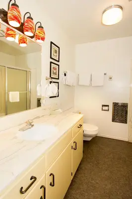 a bathroom with a sink and a toilet at Holiday Haus in Mammoth Lakes