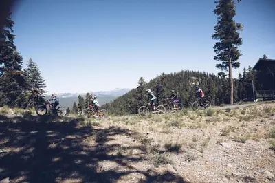 a group of people riding bikes on a hill at Cozy Aspen Grove 2 bed 2 bath condo in Truckee