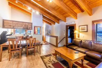 a living room with a couch and a table at Cozy Aspen Grove 2 bed 2 bath condo in Truckee