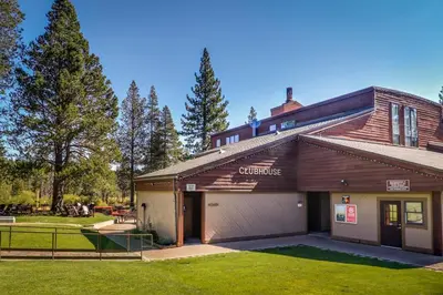 a building with a garage in a yard at Seclusion in Style in Truckee