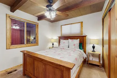 a bedroom with a bed and a ceiling fan at Seclusion in Style in Truckee