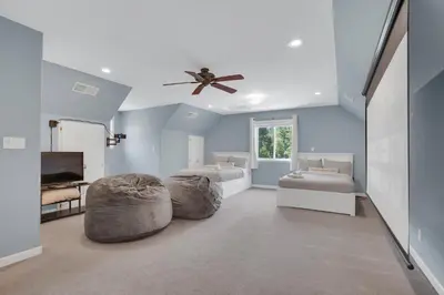 a bedroom with two beds and a ceiling fan at Moonrise Lodge - A Large Vacation Home in Mariposa in Mariposa