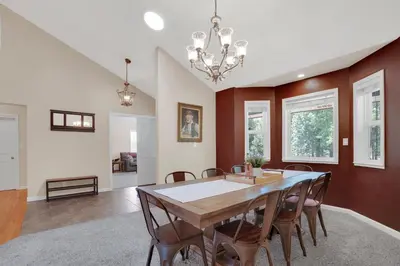 a dining room with a table and chairs at Moonrise Lodge - A Large Vacation Home in Mariposa in Mariposa