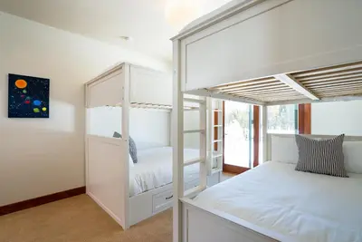 a bedroom with two bunk beds in it at Annie's Loop, Gray's Crossing 10215 in Truckee